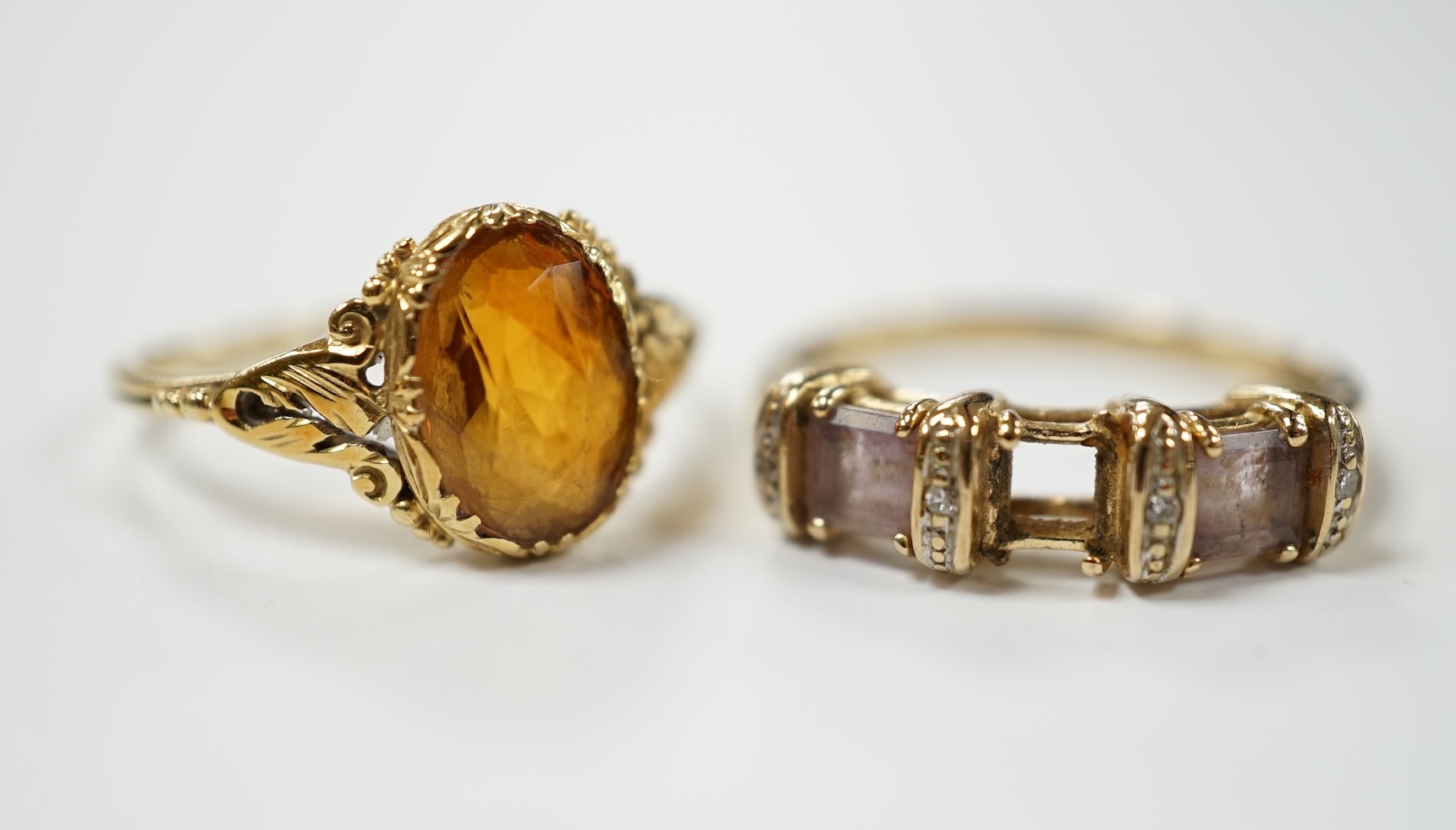 A 14k and single stone oval cut citrine set ring, size O, gross weight 2.8 grams and a modern 9ct gold and gem set ring (lacking stone), gross weight 2.3 grams. Condition - poor